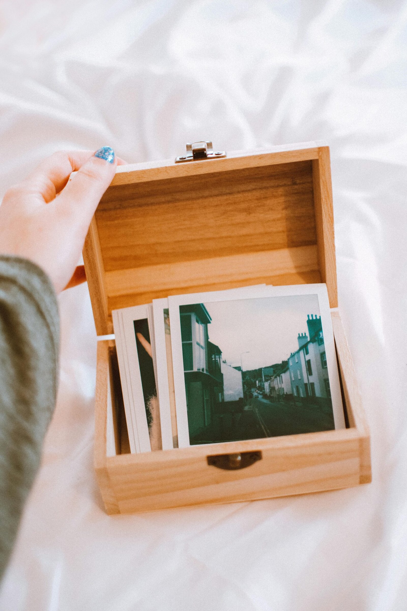 close up of photos in a wooden box