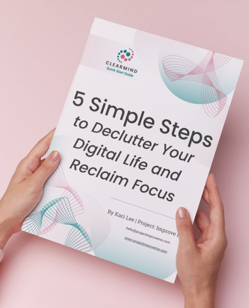 A woman in midlife gently holds a booklet, 5 Simple Steps to Declutter Your Digital Life, on a pink background offering support.