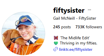 Woman in orange jacket and cap hugs brown dog. @fiftysister uplifts midlife women to thrive. 245 posts, 733K followers.